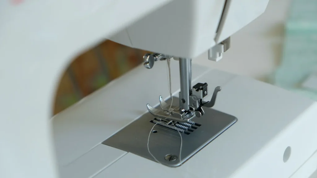 Thread routed through the winding tension guide toward the bobbin winder
