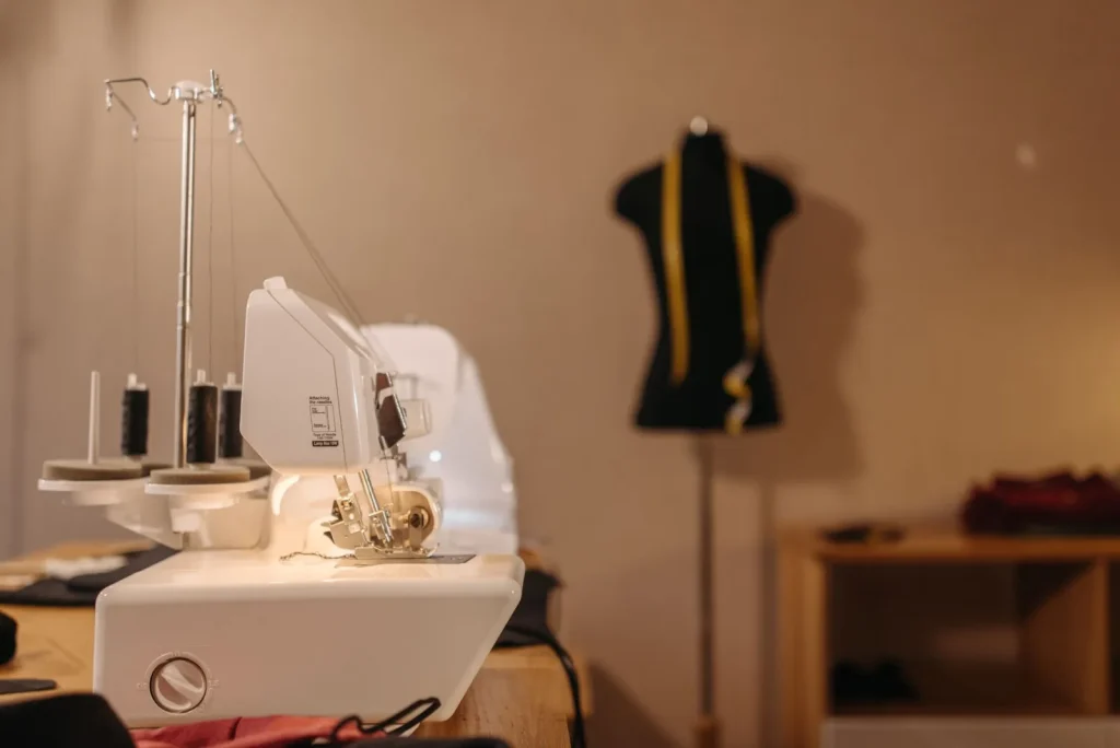 A Brother sewing machine and a Singer sewing machine displayed side by side on a store shelf
