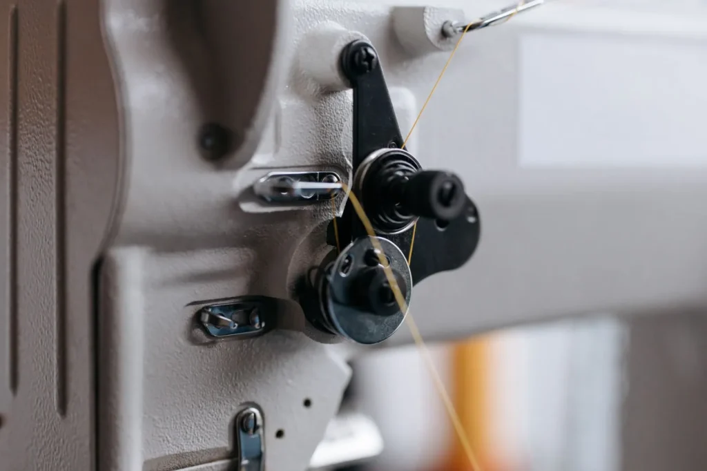 Rotary hook and bobbin case exposed after the needle plate is removed