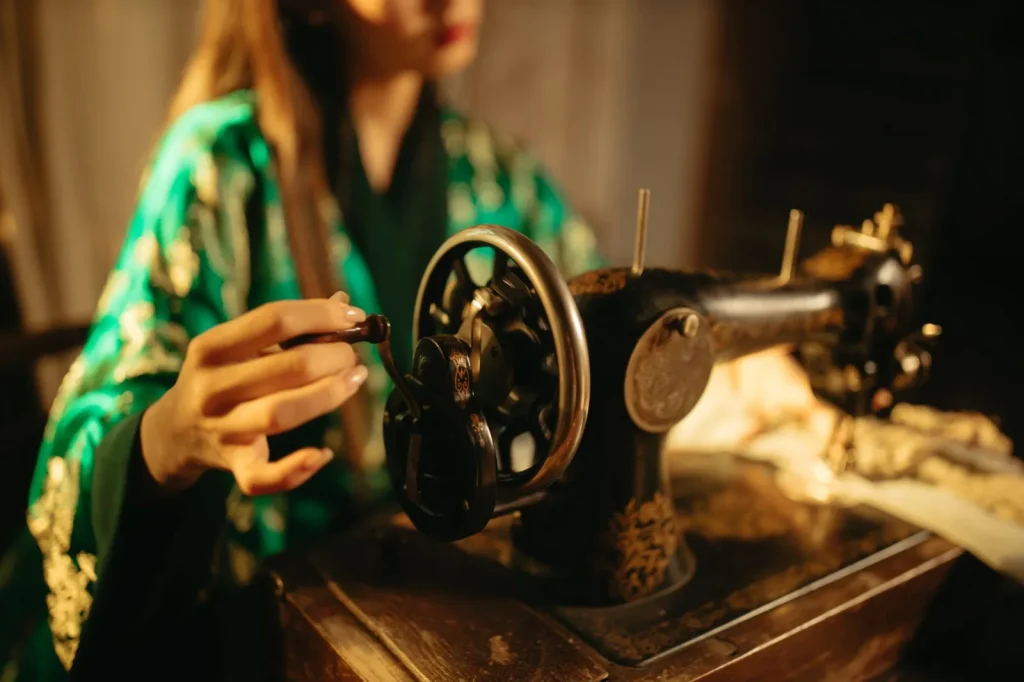A drop of oil being applied to one of the numbered oiling points on a Singer Featherweight 221