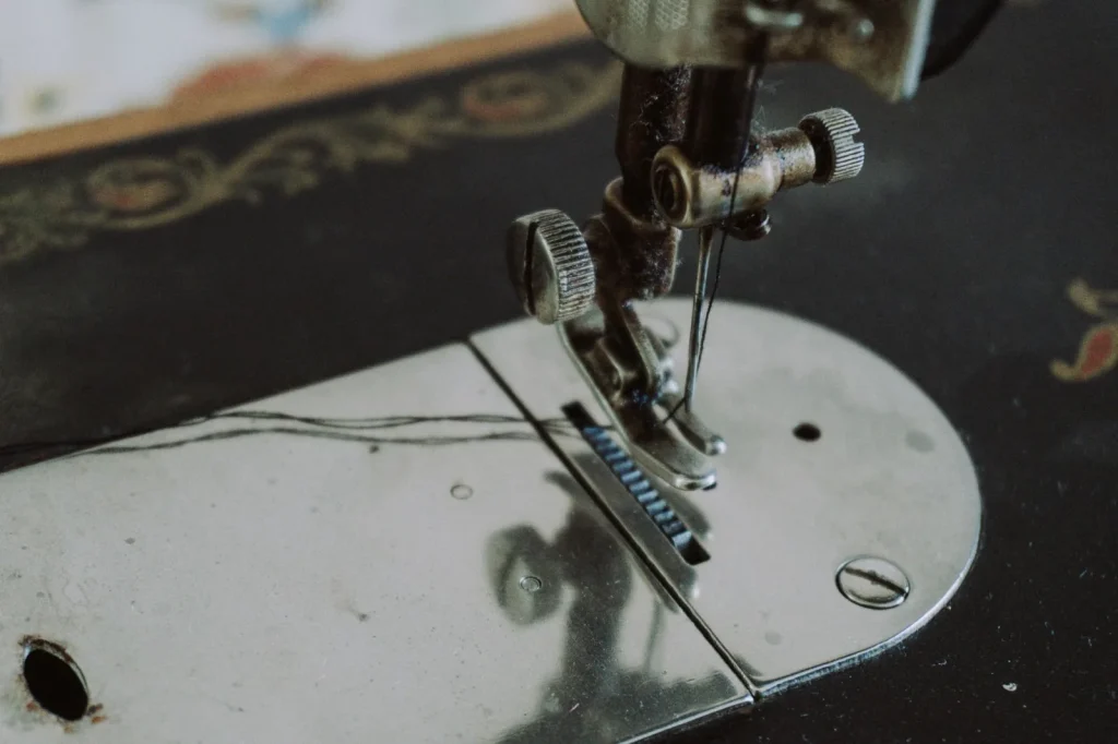 Close up of a Singer sewing machine top tension dial set between two numbers